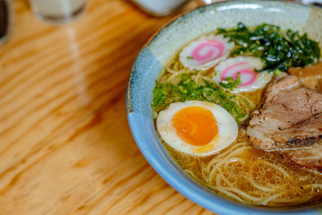 Quail ramen bowl with noodles and soft egg