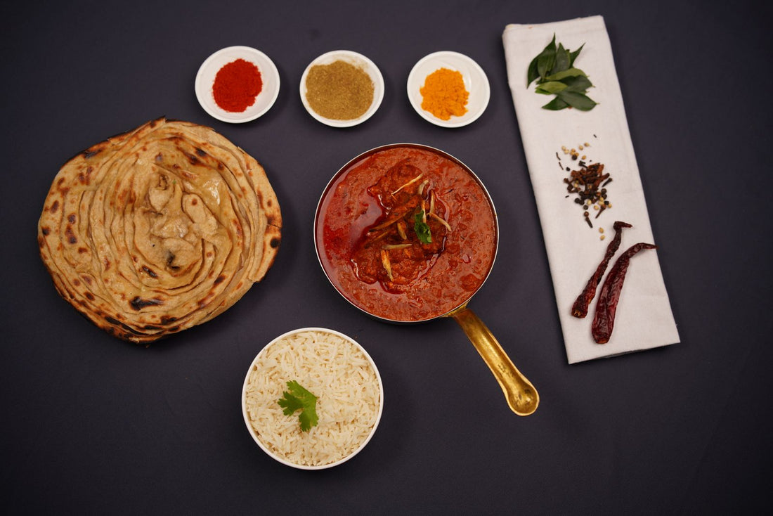 Creamy quail tikka masala with naan and rice