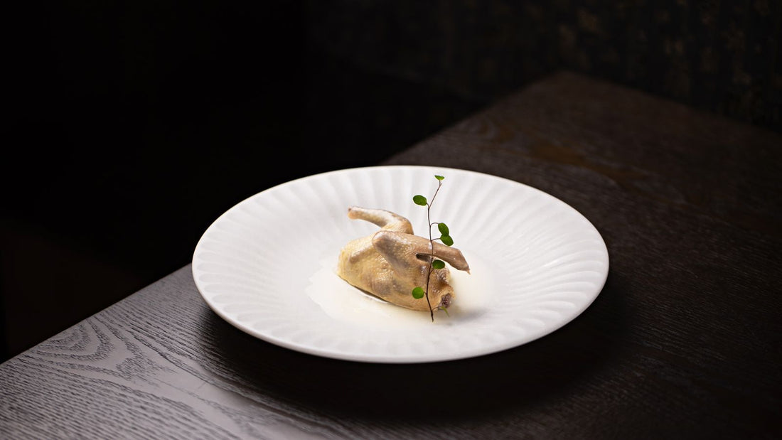 Mediterranean grilled quail plated with herbs