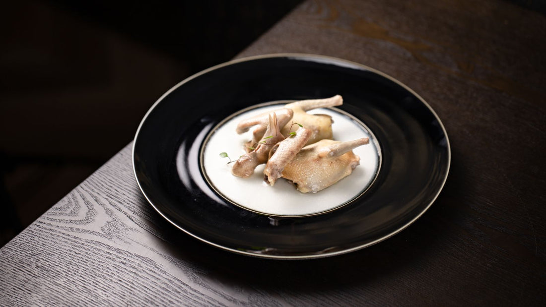 Grilled Coturnix quail with garlic and herbs on a plate