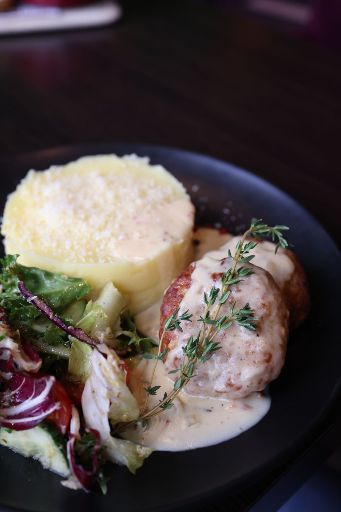 Seared quail served over creamy grits