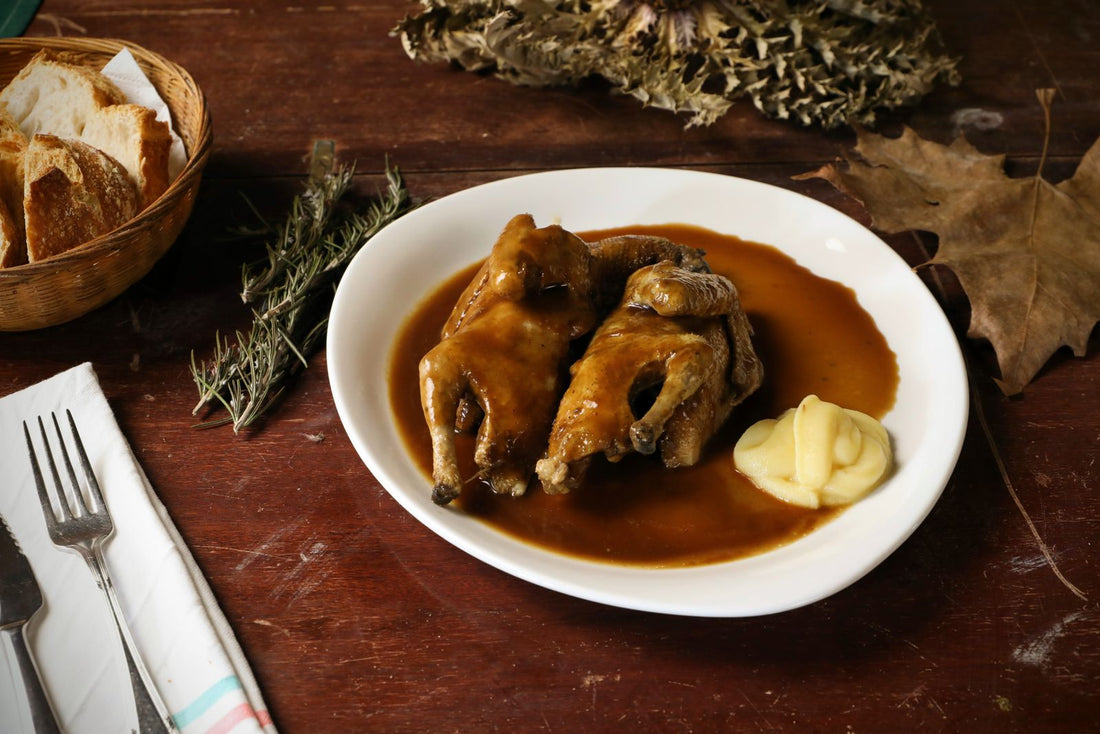 Whole stuffed roast quail with gravy and mashed potatoes