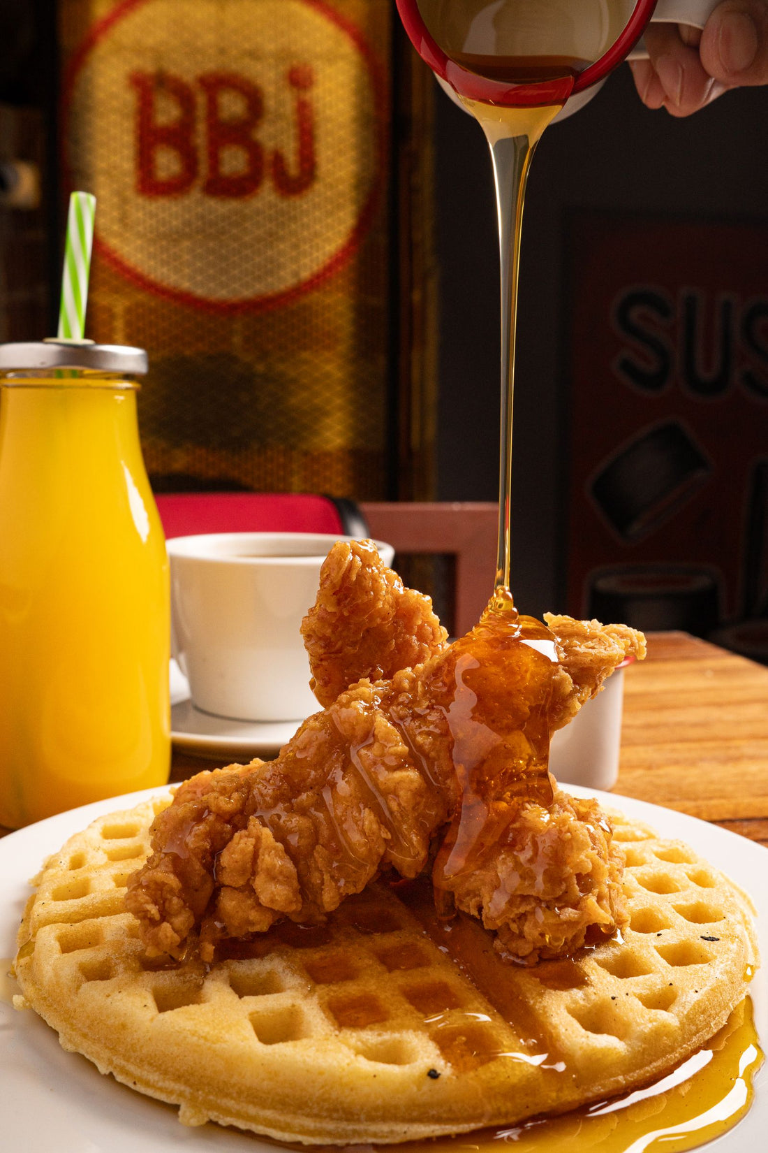 Fried quail and waffles with maple syrup