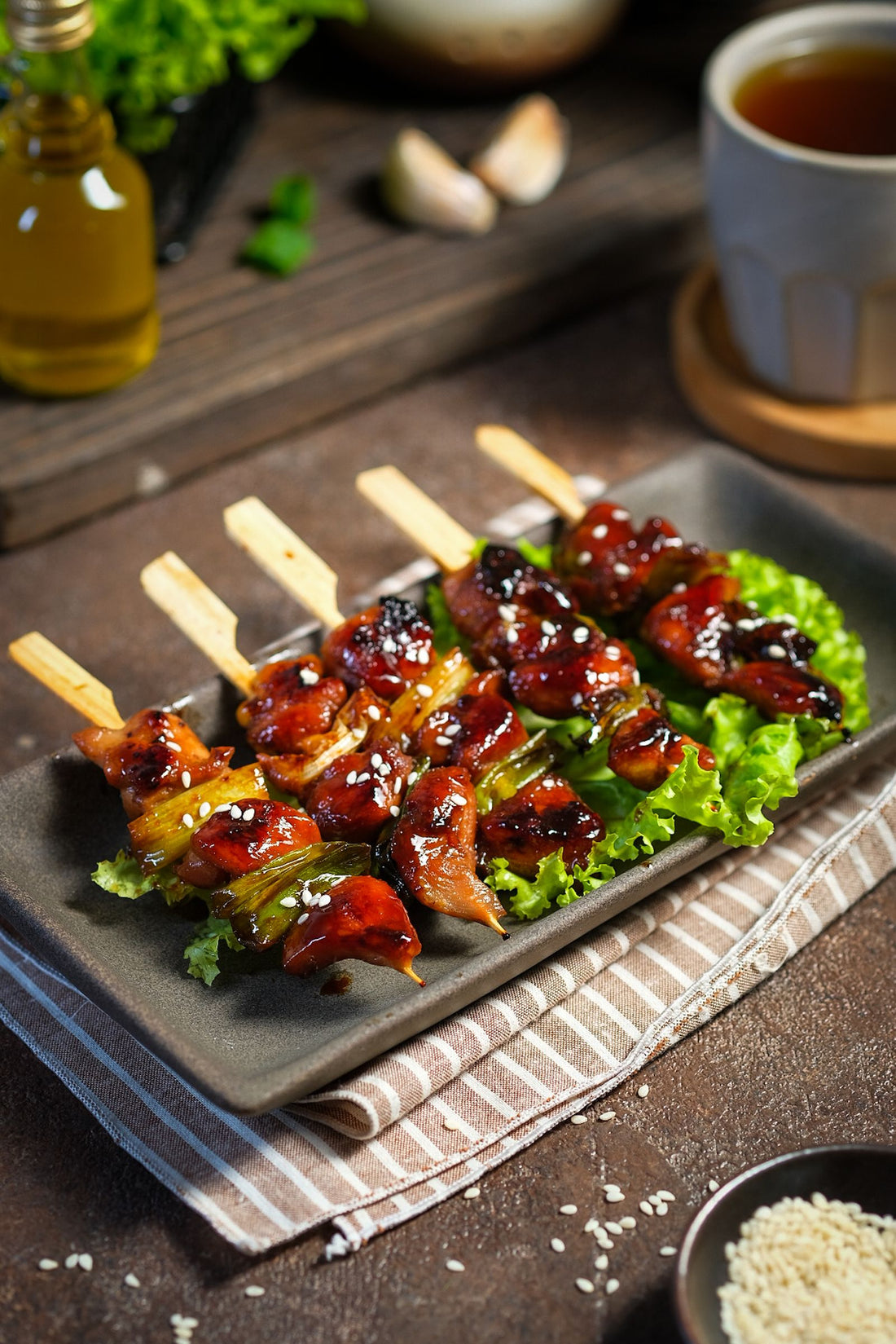 Teriyaki glazed quail skewers on the grill